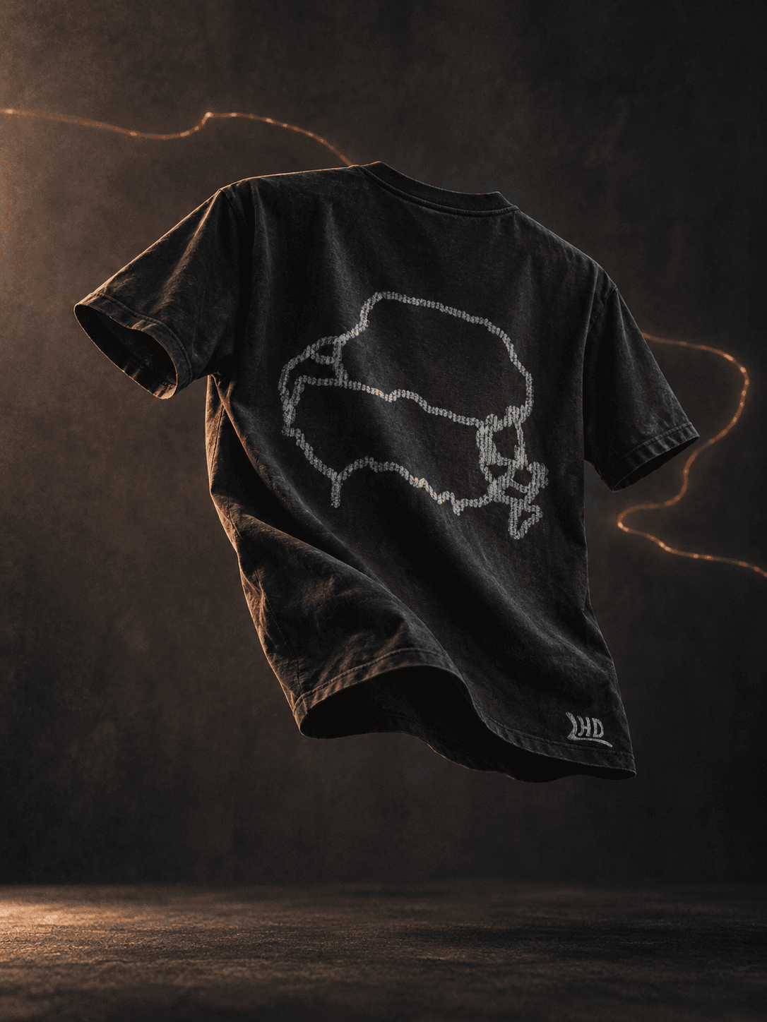 Imagined LHD tee suspended in warm light, with a glowing route line tracing the space around it